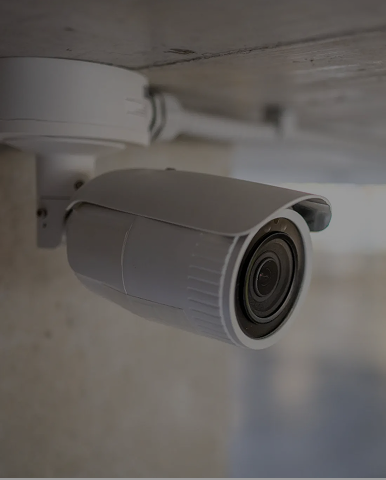 White ceiling-mounted surveillance camera