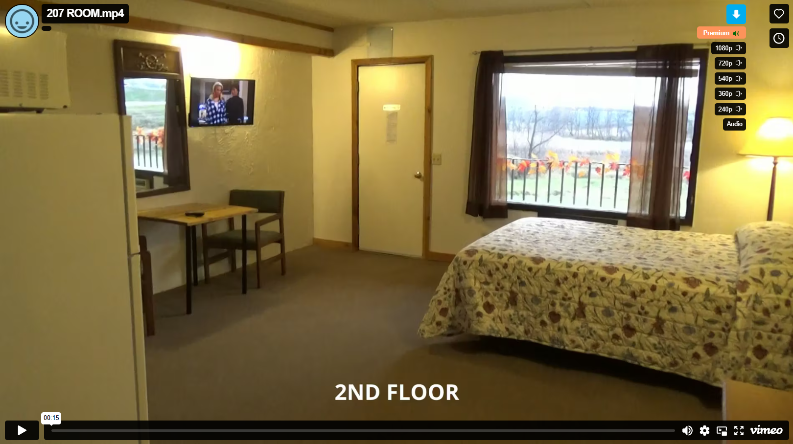 Second-floor hotel room with bed and balcony