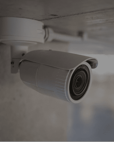 White ceiling-mounted surveillance camera
